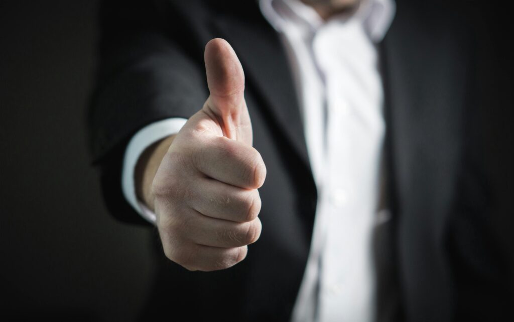 pexels photo 327533 327533 A close-up of a man's thumbs up gesture, symbolizing success and agreement.